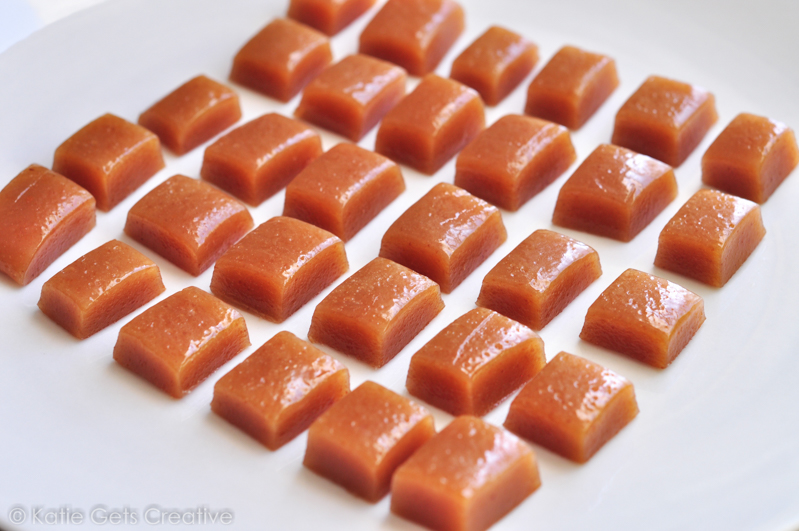 A white plate with homemade goat milk caramels cut into rectangle and square pieces