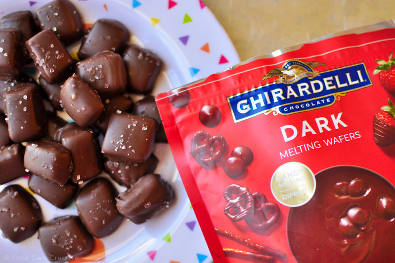 A plate of caramel candies and a bag of dark melting wafers used to make the candy