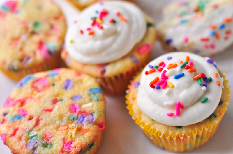 Homemade funfetti cupcakes with bright colored sprinkles and cream cheese frosting