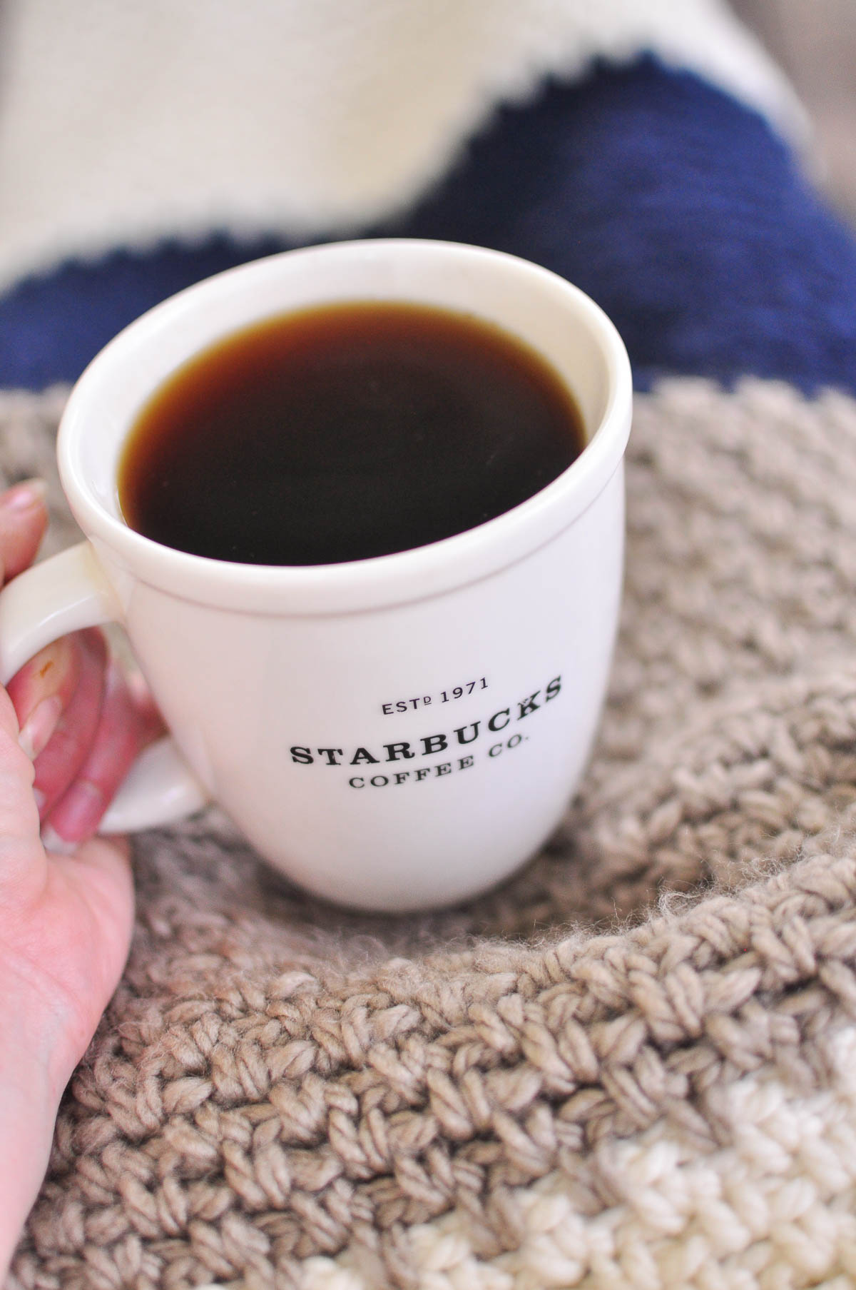Cup of coffee and blanket. 