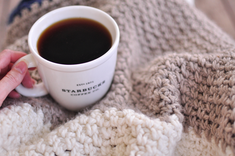 A cozy crocheted moss stitch blanket and a cup of coffee 