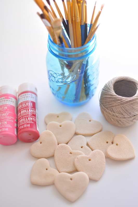 Paint, paint brushes, twine and salt dough ornaments to decorate with
