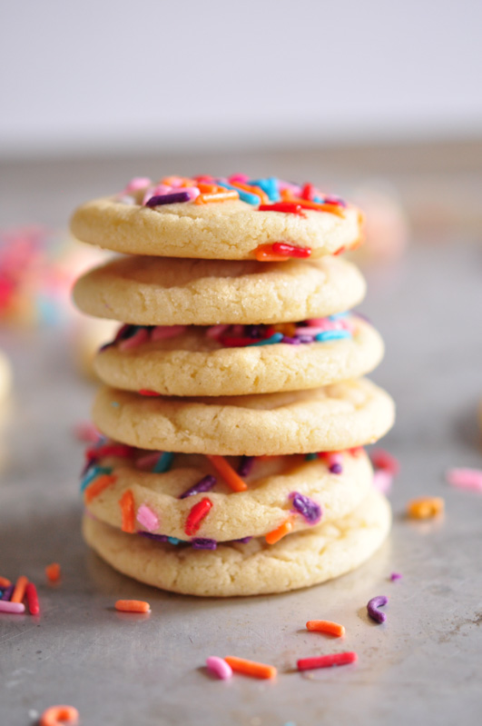 A stack of sugar cookies with sprinkles