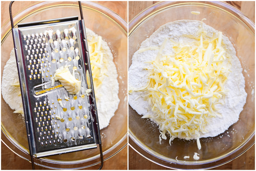 Butter being grated into a bowl of pie crust ingredients. 