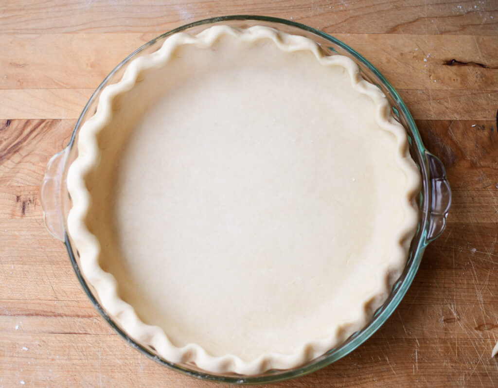 A finished pie crust waiting to be filled 