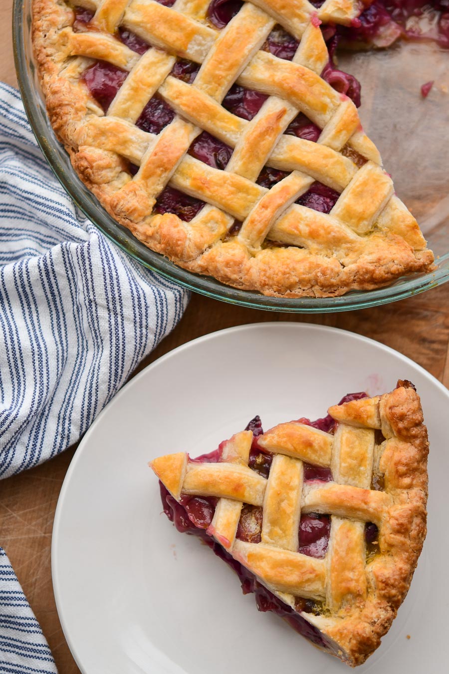 A baked and cooled muscadine pie, cut with a slice on a plate. 