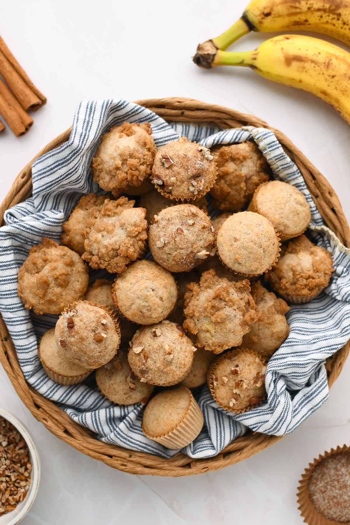A basket with a variety of banana nut bread mini muffins.