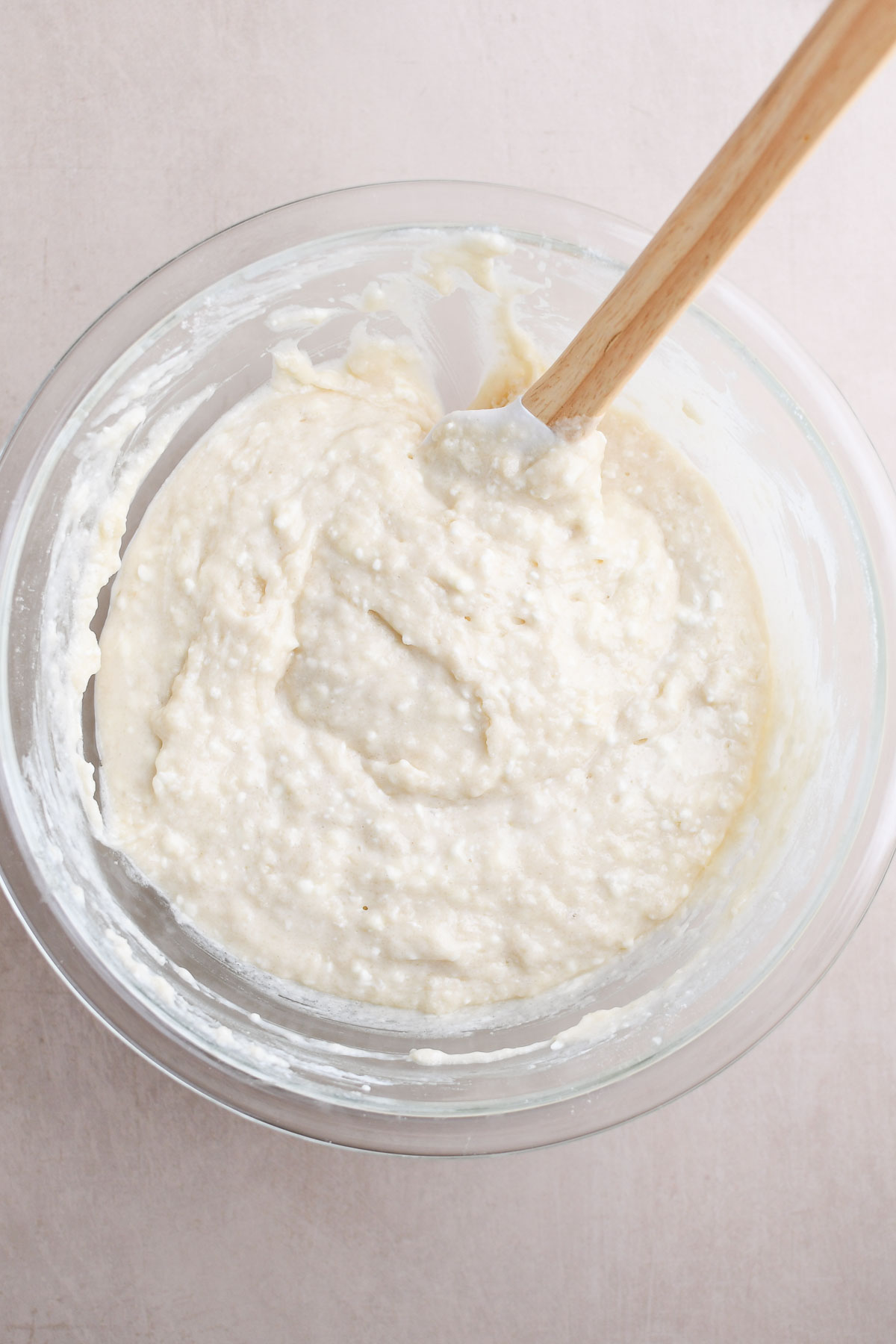 A close up of the muffin batter to show texture and cream cheese bits