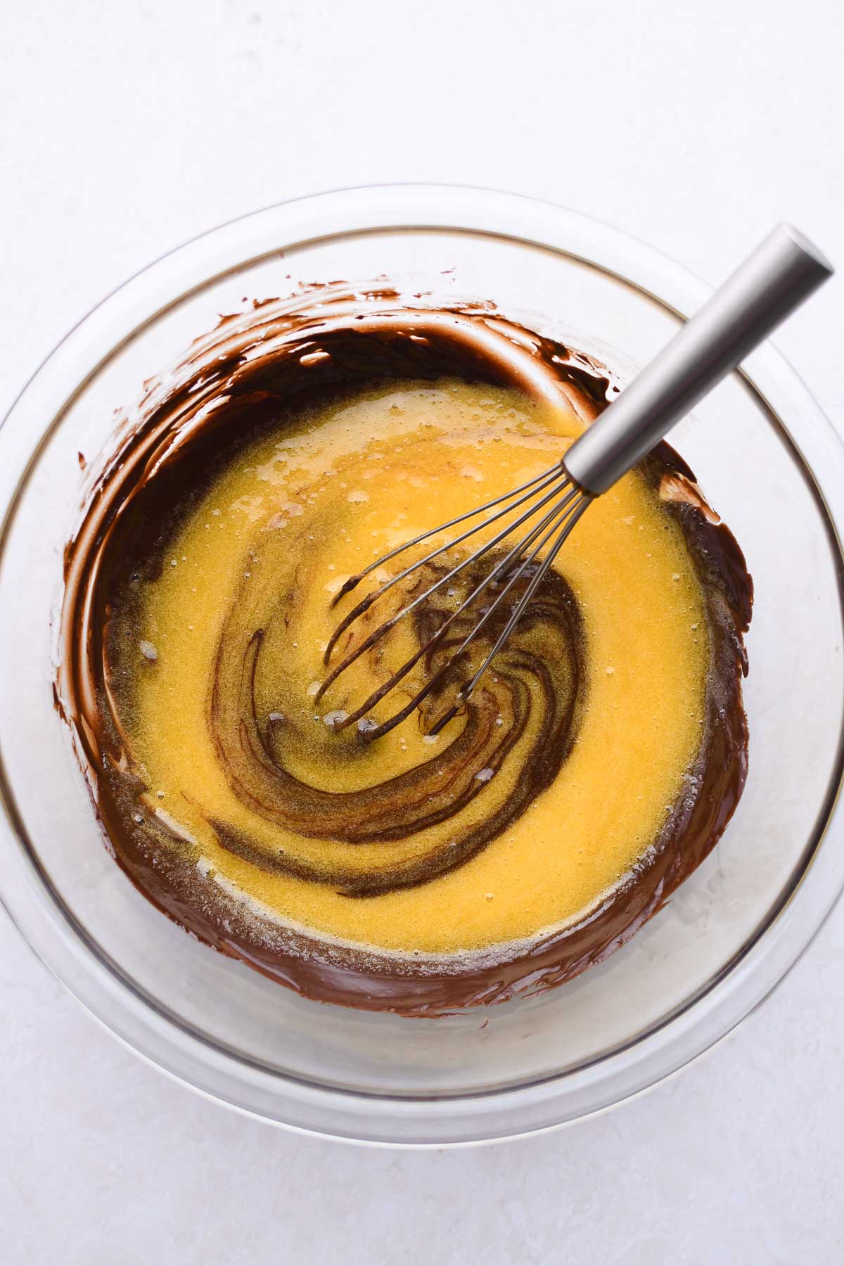 Whisking together the sugar and chocolate. 