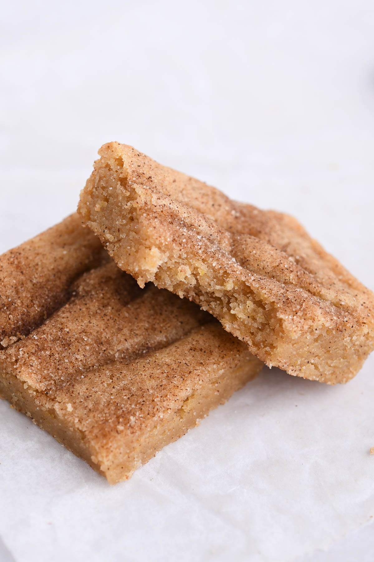 A close up bite shot of a snickerdoodle bar. 