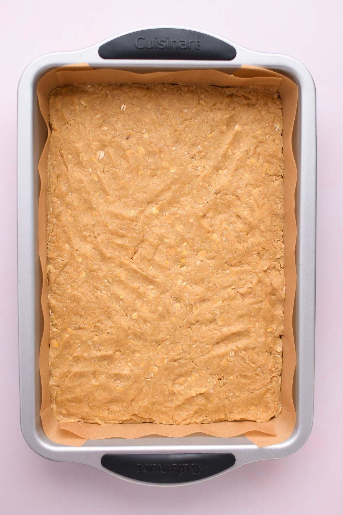 Cookie dough spread evenly in a 9x13 pan. 