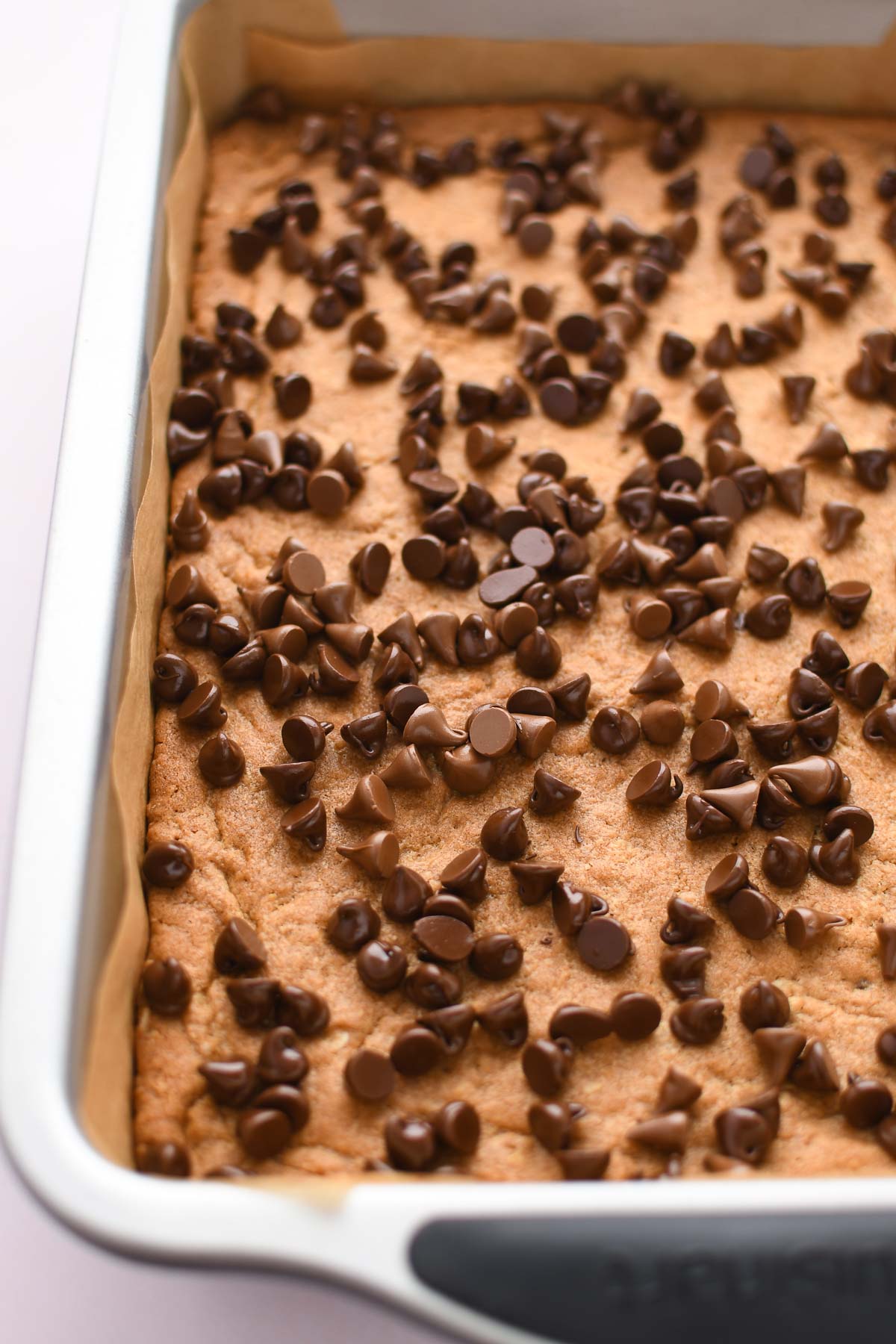 Melting chocolate chips in the warm pan. 