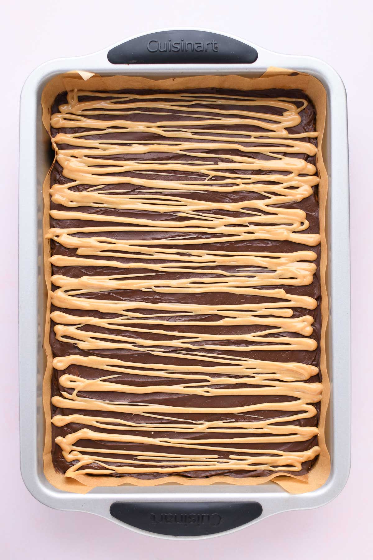 The pan of peanut butter fingers after adding the peanut butter icing. 