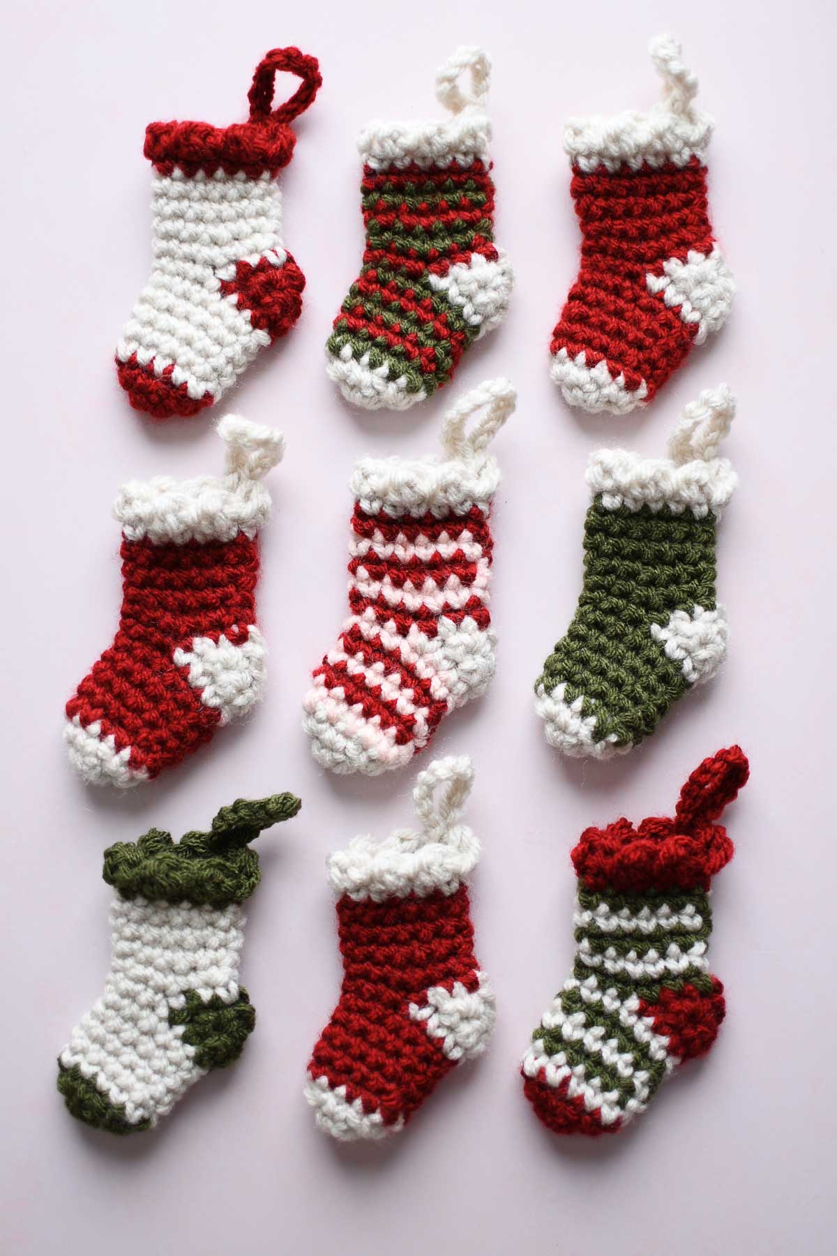 9 crochet stockings in a 3x3 grid pattern.